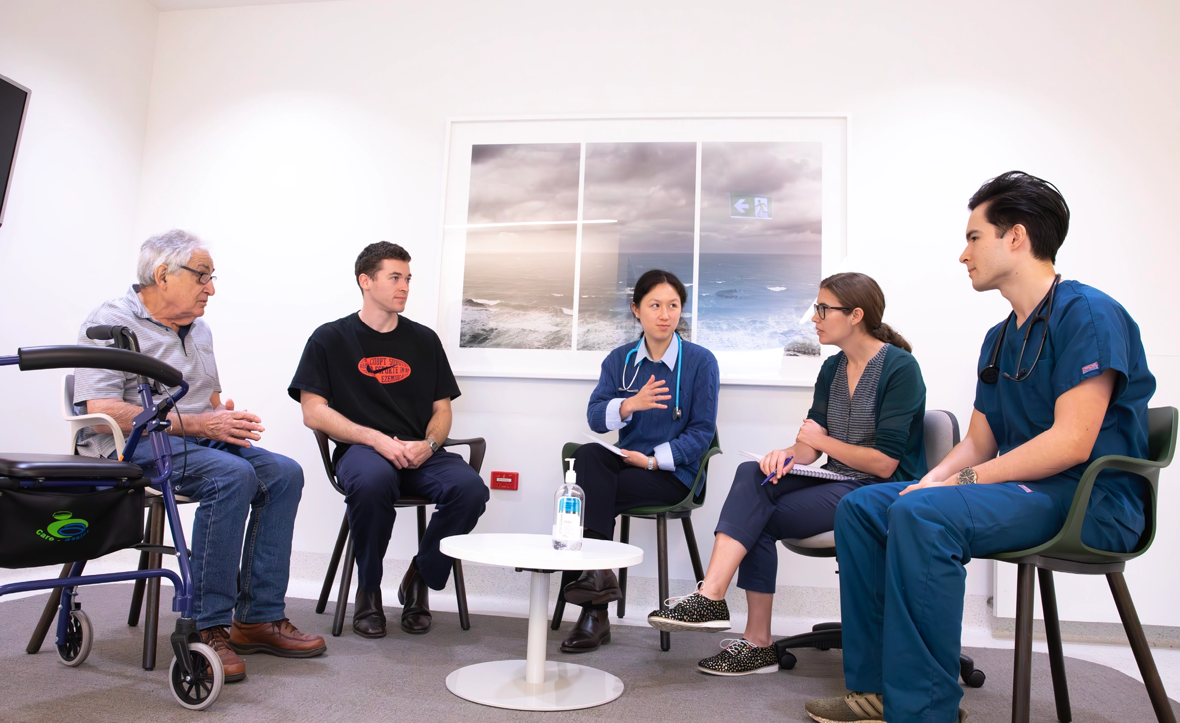 Doctors talking with patient and carer