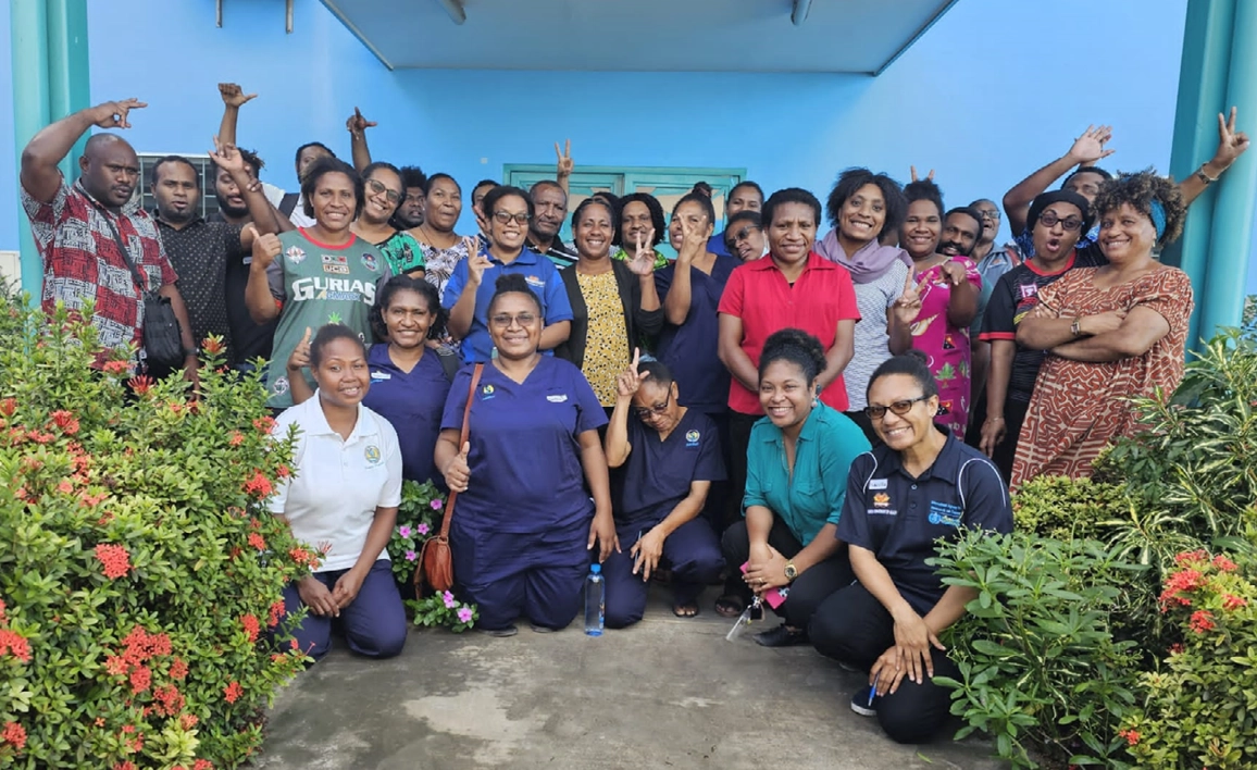 Group of medical professionals in Papua New Guinea smiling at camera