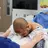 Two doctors conducting a procedure with a patient