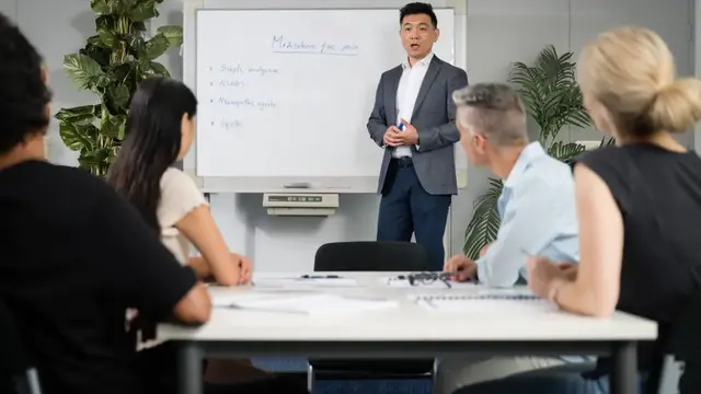 A man doing a presentation for colleagues