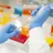 A researcher pipetting in a lab setting