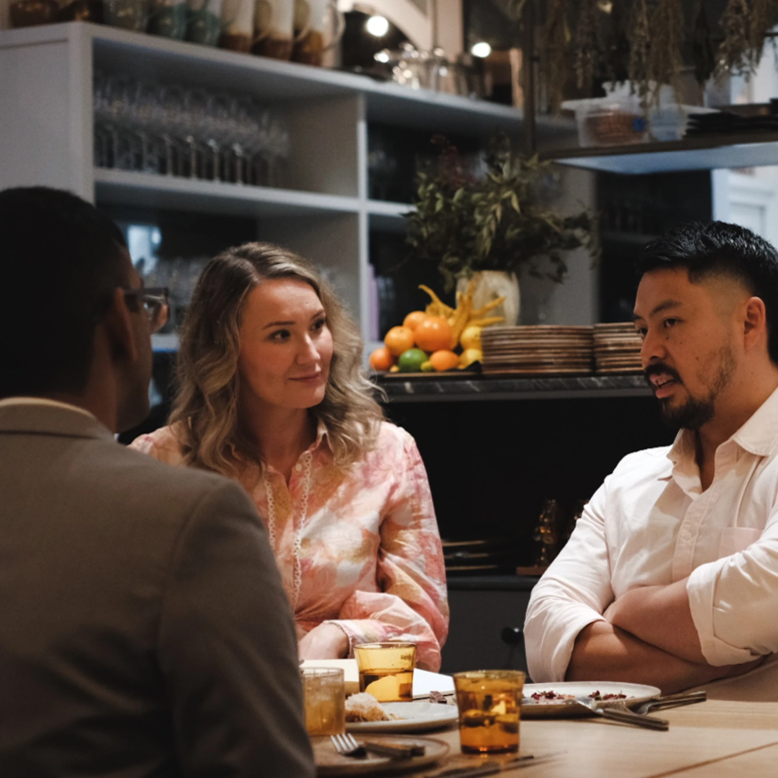 Three people talking