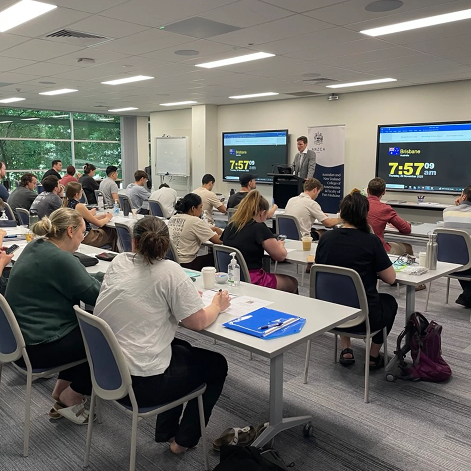 People sitting a mock exam