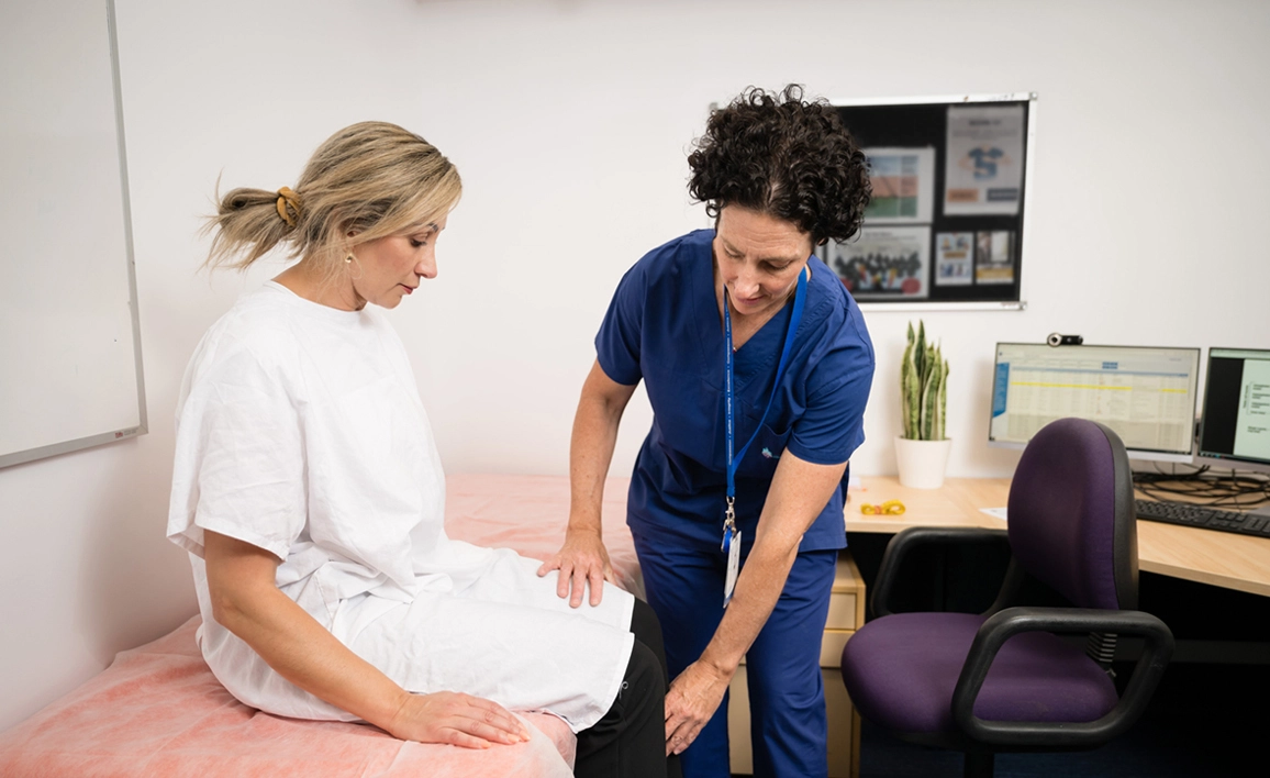 Doctor testing a patient's leg