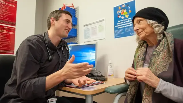 Doctor talking to patient in office 