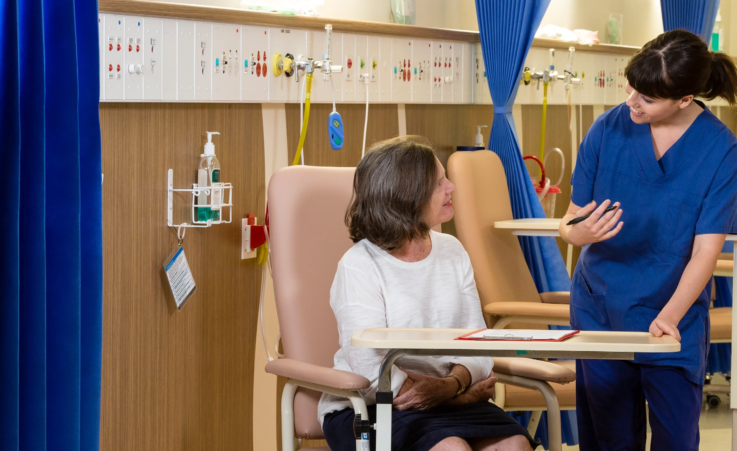 Photo of patient and doctor speaking